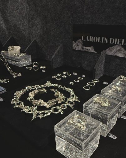 Sculptural silver chain on display.