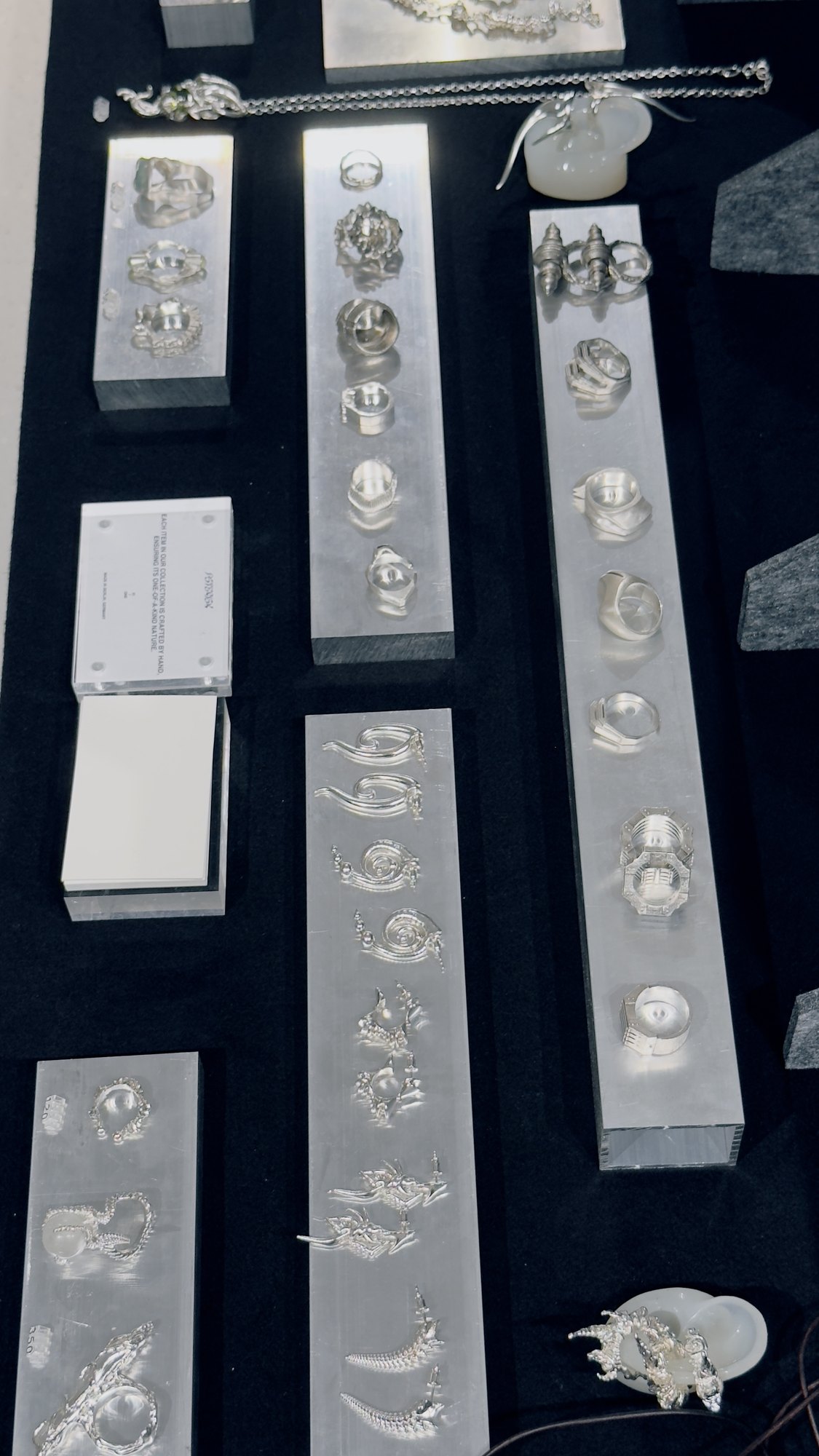 A slate of silver rings with stones.