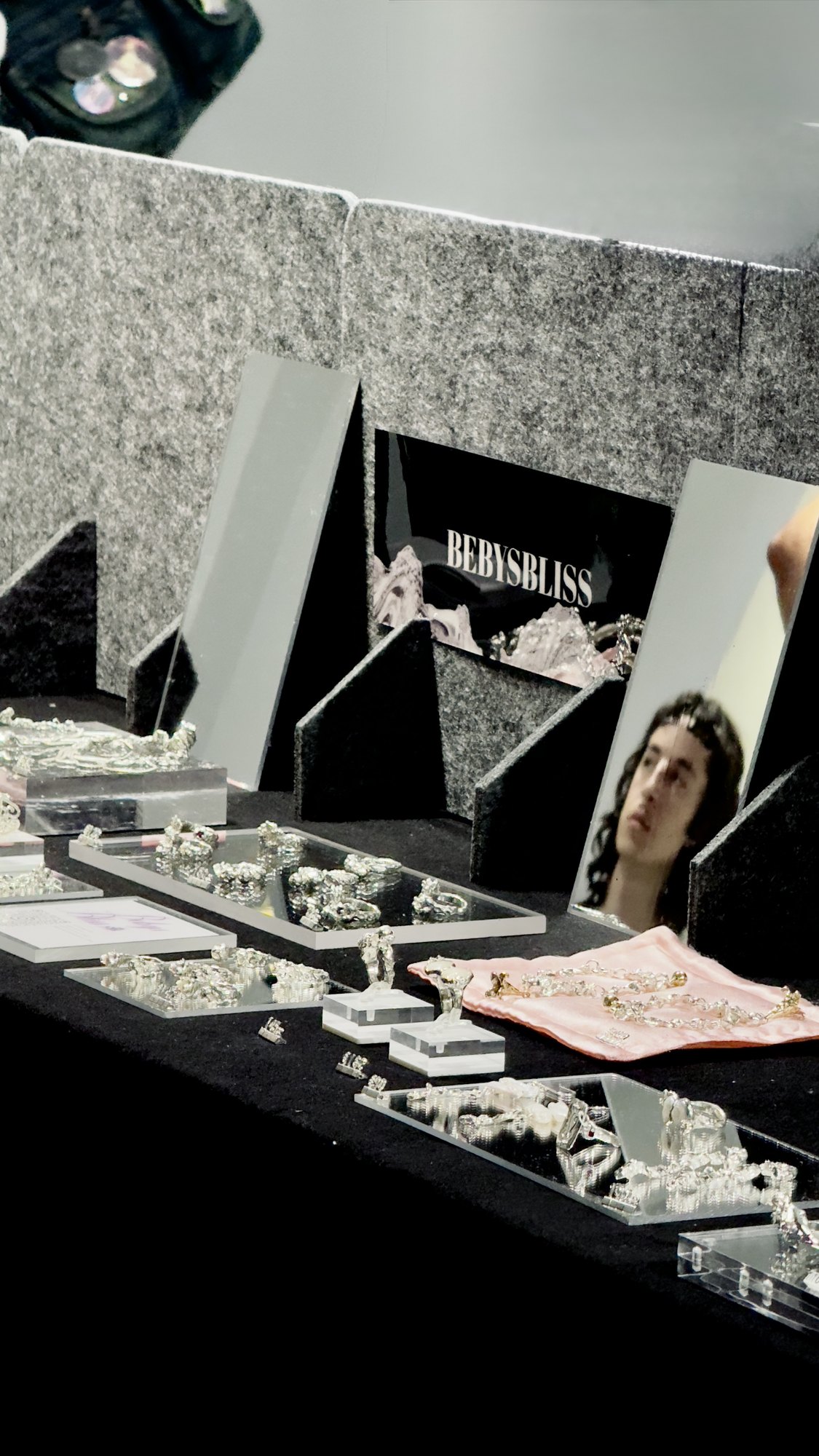 Silver rings set in acrylic trays.